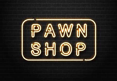 neon sign spelling out pawn shop on a black brick wall background